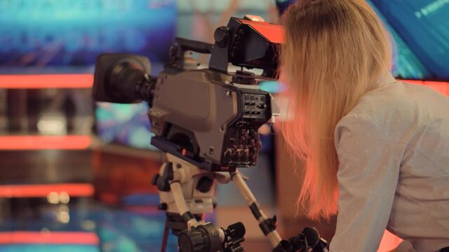 Television Operator On TV Broadcasting Production Channel. Camera Operator On News Room Shoot Media Movie.Making TV Show Or Film.Camerawoman Working In TV Studio Video Production Filming Interview.