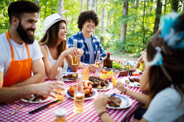 Small group of friends having fun at barbecue party