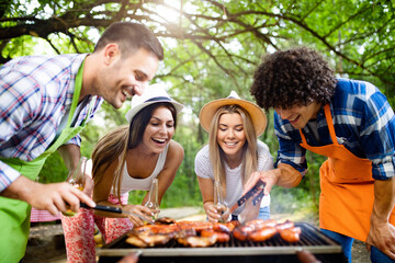 Small group of friends having fun at barbecue party