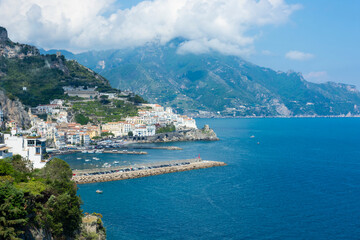 Obraz premium Panoramic view of beautiful Amalfi on hills leading down to coast, Campania, Italy. Amalfi coast is most popular travel and holiday destination.
