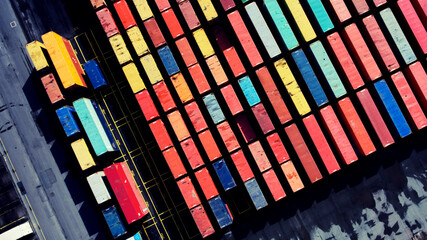 Top view aerial photo of freight containers in rows at harbor. Global Logistics Shipping industry. Export and Import transportation services. Cargo container with copy space for shipping brand goods