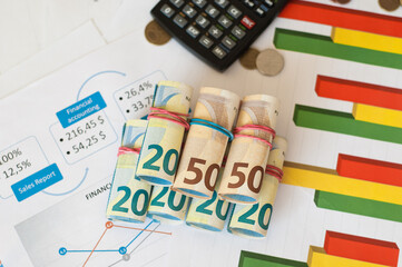 Euro banknotes, calculator, Accountant at work