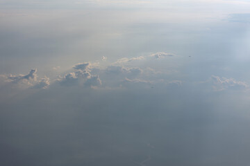 View from the plane on the clouds and other liners flying past. The concept of travel. Upper atmosphere. Above the clouds. Passenger aircraft