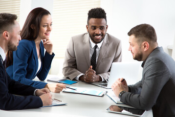 Multy-ethnic group of business people working at office