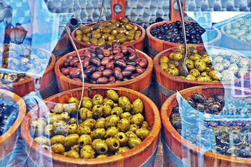 variety of olives and many kind of fruit pickle in wooden tray for sale in local shop in Munich...