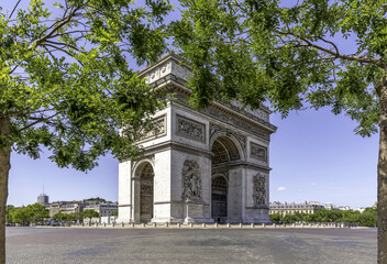 Fototapeta na wymiar Paris, France - June 22, 2020: A view of the Arc de Triomphe with no-traffic located in Paris in summer