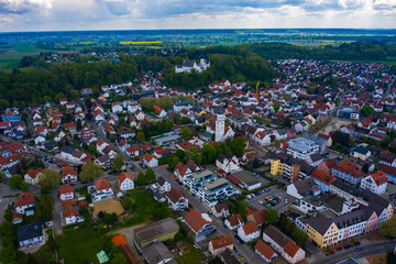 Aerial view of the city Illertissen Iller and castle Vöhlinschloss in Germany on a cloudy spring day during the coronavirus lockdown.
