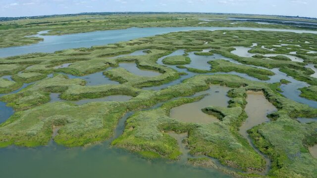 Aerial pan shot over salt marsh