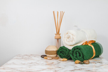 Spa objects and elements on a marble table and white background