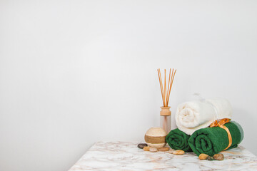 Spa objects and elements on a marble table and white background
