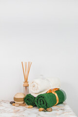 Spa objects and elements on a marble table and white background