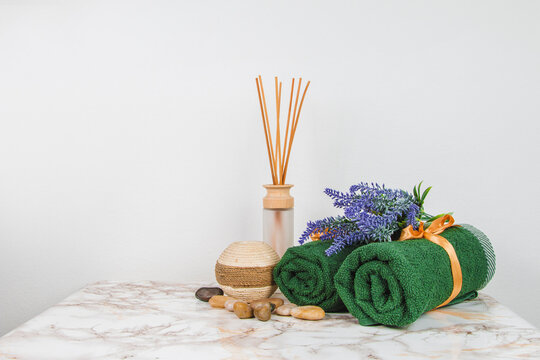 Spa objects and elements on a marble table and white background
