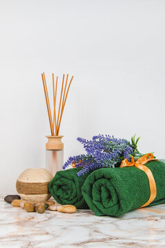 Spa objects and elements on a marble table and white background