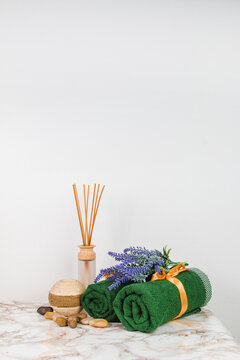 Spa objects and elements on a marble table and white background