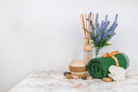 Spa objects and elements on a marble table and white background