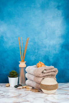 Spa objects and elements on a marble table and blue background