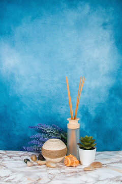 Spa objects and elements on a marble table and blue background