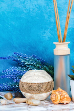 Spa objects and elements on a marble table and blue background
