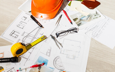Tools and papers with sketches on the table