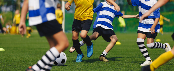 Soccer Players Run. Young Boys Running After Ball During Football Tournament Match. Sports School...