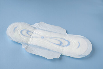 Female intimate hygiene product on a blue background. Gynecology. PMS