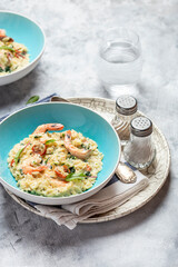 Orzo pasta with king shrimp, sun-dried tomatoes and spinach