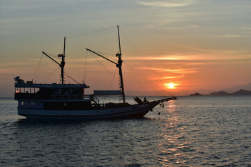 Fototapeta premium Fishing boat at sunset, Komodo Island, Labuan Bajo, East Nusa Tenggara, Indonesia