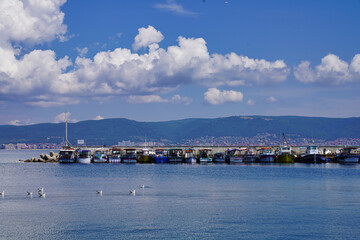 Nesebar boat harbour, Sunny Beach resort at the distance.