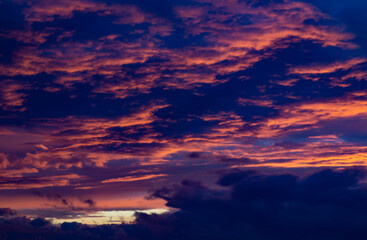 Fototapeta na wymiar Red clouds at sunset close up