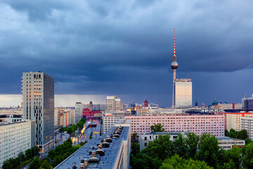 Berlin sunset cityscape aerial view with tv tower in heavy storm conditions