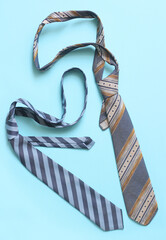 Ties on a blue background, close up