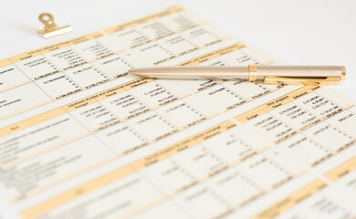 glasses and financial documents are on the table