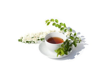 White tea mug with flowers on white background
