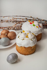 Easter cakes and glitter eggs on the white background. Happy easter