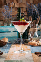 Sweet cherry jam dessert with cream martini glass