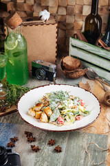 Appetizing caesar salad with crackers 