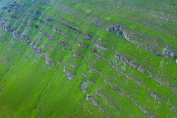 Aerial view of the spring landscape of rocks and grasslands in the Estacas de Trueba. Vega de Pas, Valles Pasiegos, Cantabria, Spain, Europe