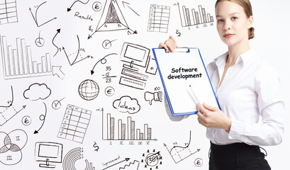 Business, technology, internet and network concept. Young businessman thinks over the steps for successful growth: Software development