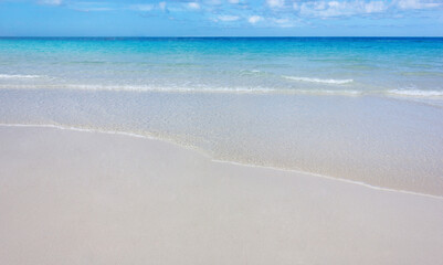 Fototapeta na wymiar Sea view from tropical beach. Beautiful beach with white sand, turquoise ocean water.