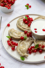 Polish traditional ravioli with cherries 