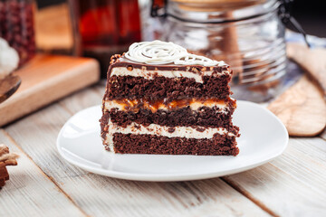 Slice of sweet chocolate sponge cake with nougat