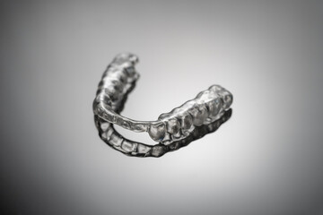 night dental guard by bruxism on gray background