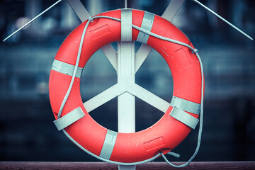 Lifebuoy on quay, mooring in port, object