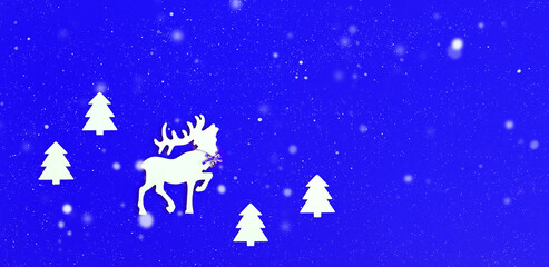 White wooden figure of deer with big horns in fir tree forest. Snow is falling. Concept for New Year or Merry Christmas. Christmas Holiday banner.