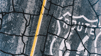 Bird’s eye view of painted on cracked asphalt roadside number sign of American landmark Route 66,...