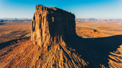 Bird's eye scenery view of unique geological formation of Arizona landmark. Monument Valley rocks one of the National symbols of the United States of America. Sandy desert landscape with mountains © BullRun