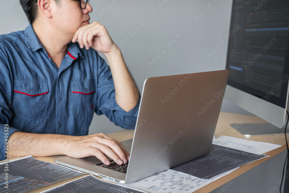 Leinwandbilder Young programmer working at developing programming and website working in a software