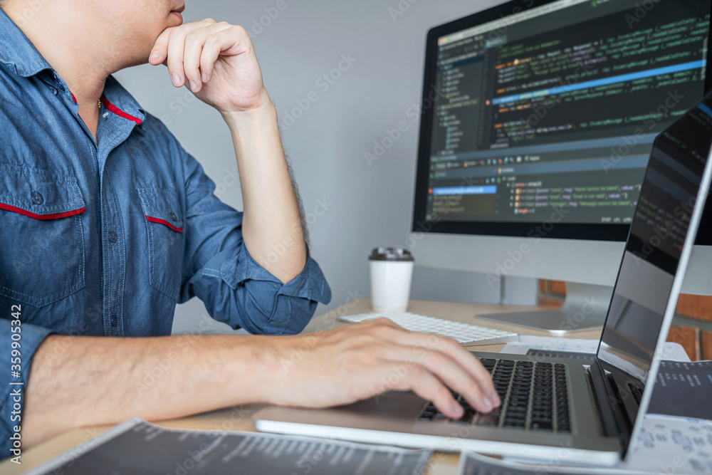 Fototapete Young programmer working at developing programming and website working in a software