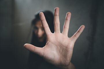 woman raised her hand for dissuade, Abuse, campaign stop violence against women. Stop sexual harassment and rape. - obrazy, fototapety, plakaty