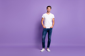 Full length body size view of his he nice attractive sportive content cheerful cheery guy model posing isolated over bright vivid shine vibrant violet lilac purple color background
